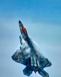 Low angle view of airplane flying in sky