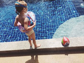 Full length portrait of shirtless boy in swimming pool