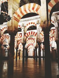 Low angle view of illuminated lanterns hanging in building