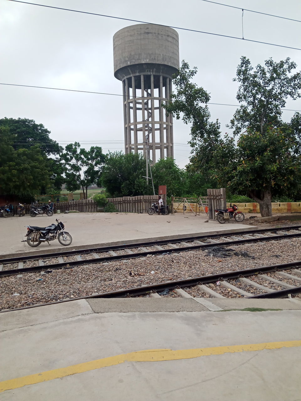 VIEW OF RAILROAD STATION PLATFORM AGAINST SKY