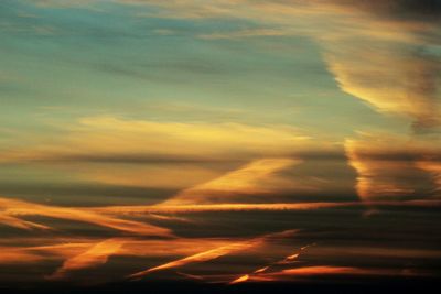 Low angle view of cloudy sky at sunset