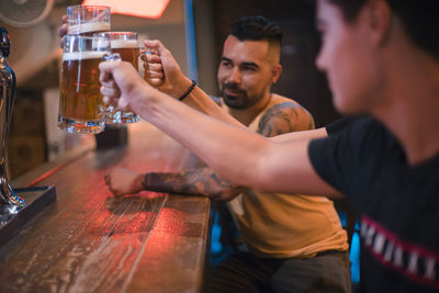 Group of people drinking glass on table