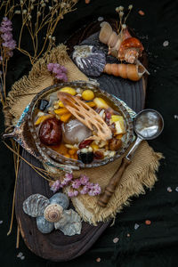 High angle view of fruits in basket on table