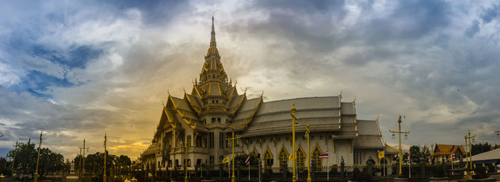 Low angle view of temple building against cloudy sky