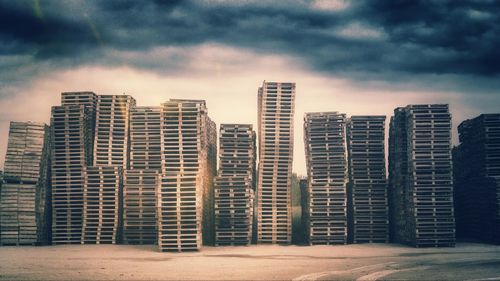 Buildings against cloudy sky