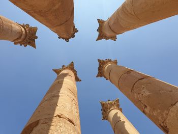 Low angle view of historical building against blue sky