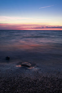 Scenic view of sea at sunset