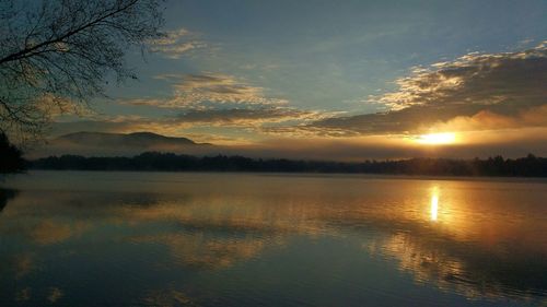 Scenic view of lake at sunset