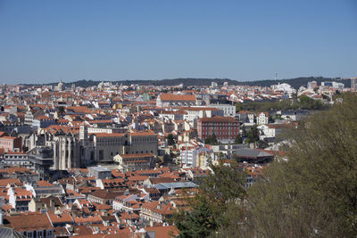 Aerial view of townscape against clear sky