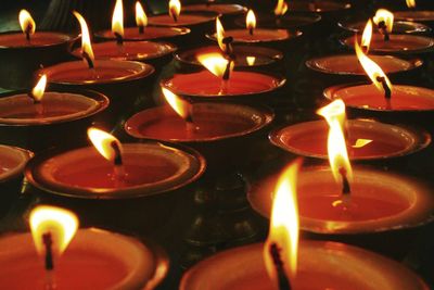 Close-up of lit tea light candles