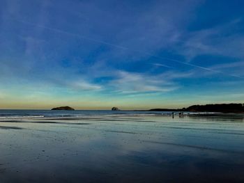 Scenic view of sea against sky during winter