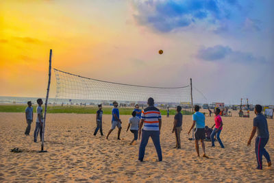Group of people playing on beach