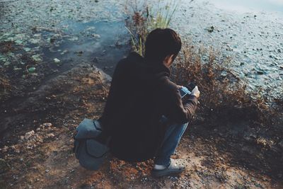 High angle view of man using smart phone