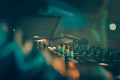 Close-up of sound mixer at nightclub