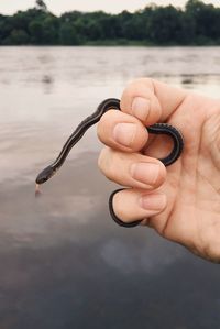 Close-up of hand holding water