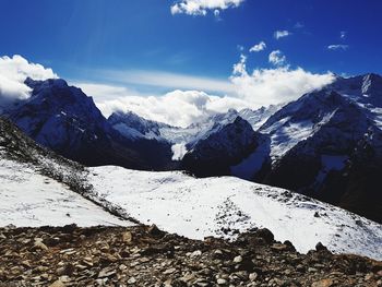 Scenic view of snowcapped mountains against sky