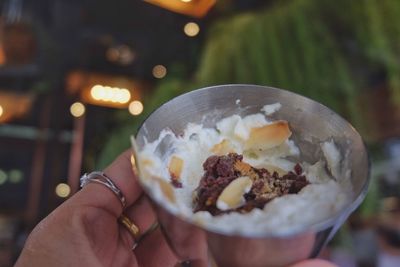 Midsection of person holding ice cream