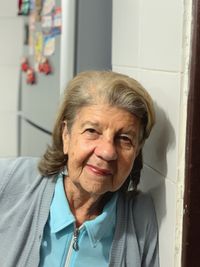 Portrait of smiling woman at home