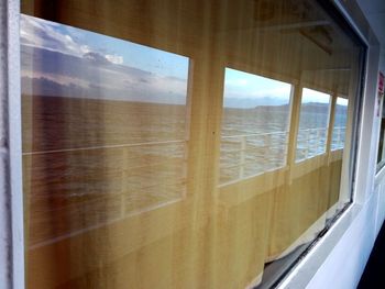 View of sea through window