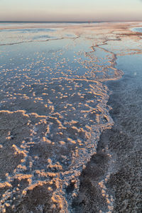 High angle view of sea shore against sky