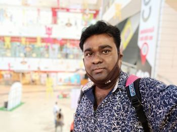 Portrait of young man standing outdoors