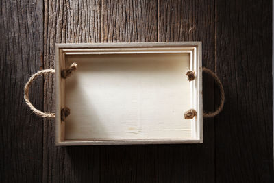 Directly above shot of empty box on wooden table