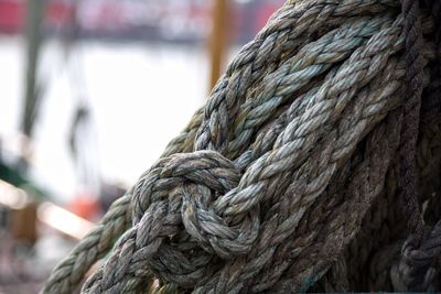 Close-up of rope tied up on metal