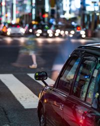 Cars on city street at night