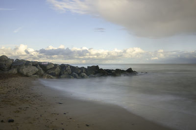 Scenic view of beach against sky