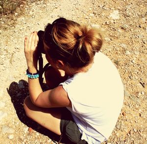 Girl sitting outdoors