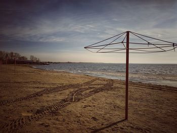 Scenic view of beach against sky during sunset