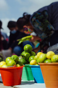 Lemons with seed for sale in a market with measure of bucket