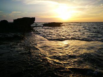 Scenic view of sea against sky during sunset