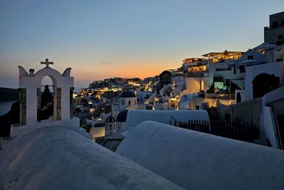 Cityscape against clear sky during sunset