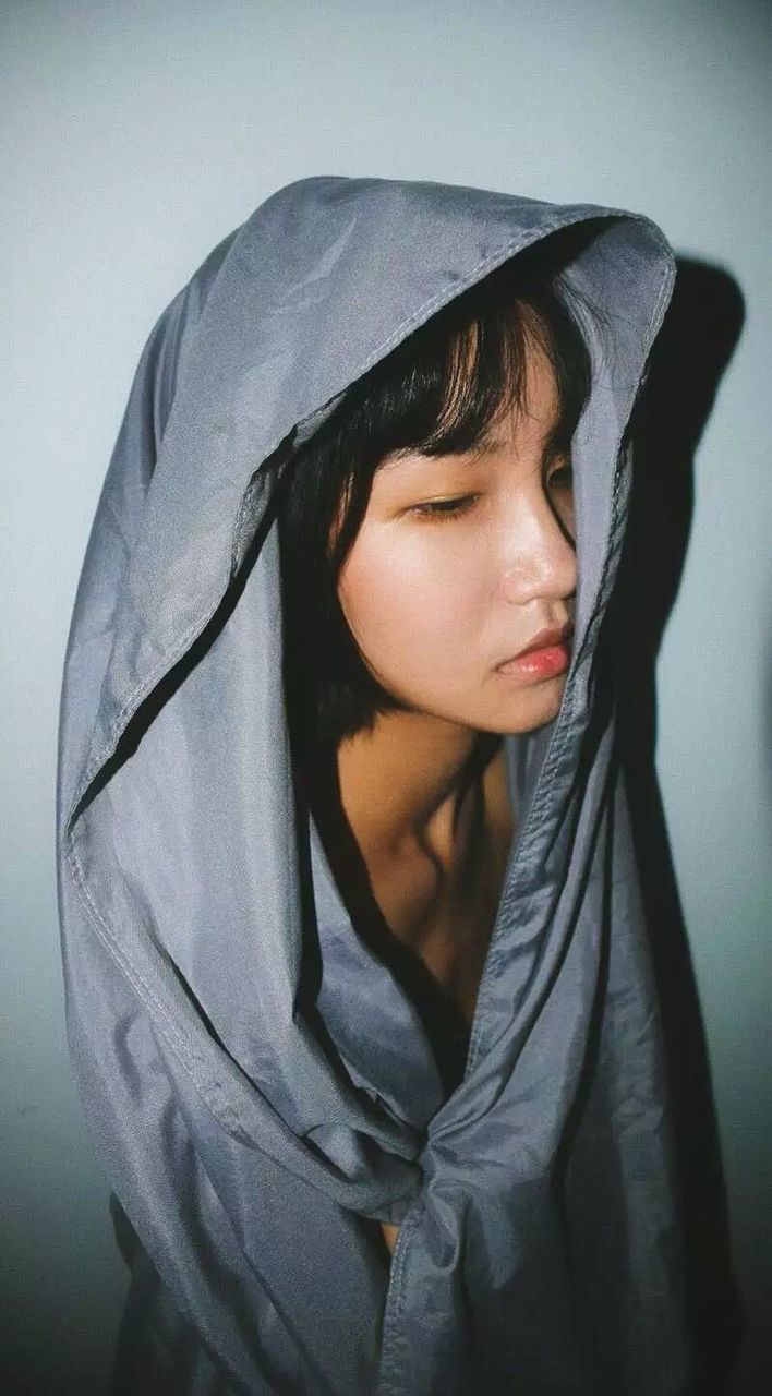sadness, depression - sadness, one person, contemplation, sulking, young adult, headshot, hood - clothing, looking down, young women, fragility, people, only women, close-up, adult, adults only, day