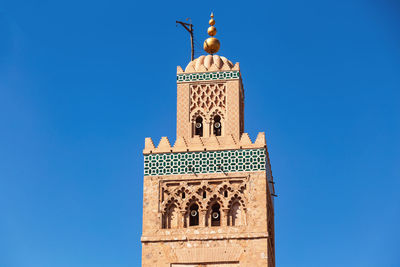 Low angle view of koutoubia mosque against sky - marrakech, morocco - travel destinations