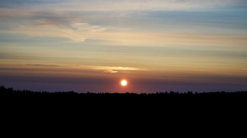 Scenic view of silhouette landscape against sky during sunset