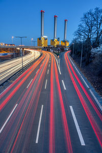 Freeway and power station at dusk seen in berlin, germany