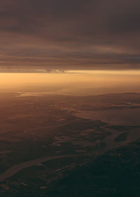 Aerial view of landscape against sky during sunset