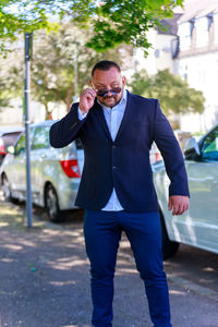 Full length of a man standing on street in city