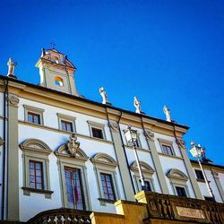 Low angle view of building against clear blue sky