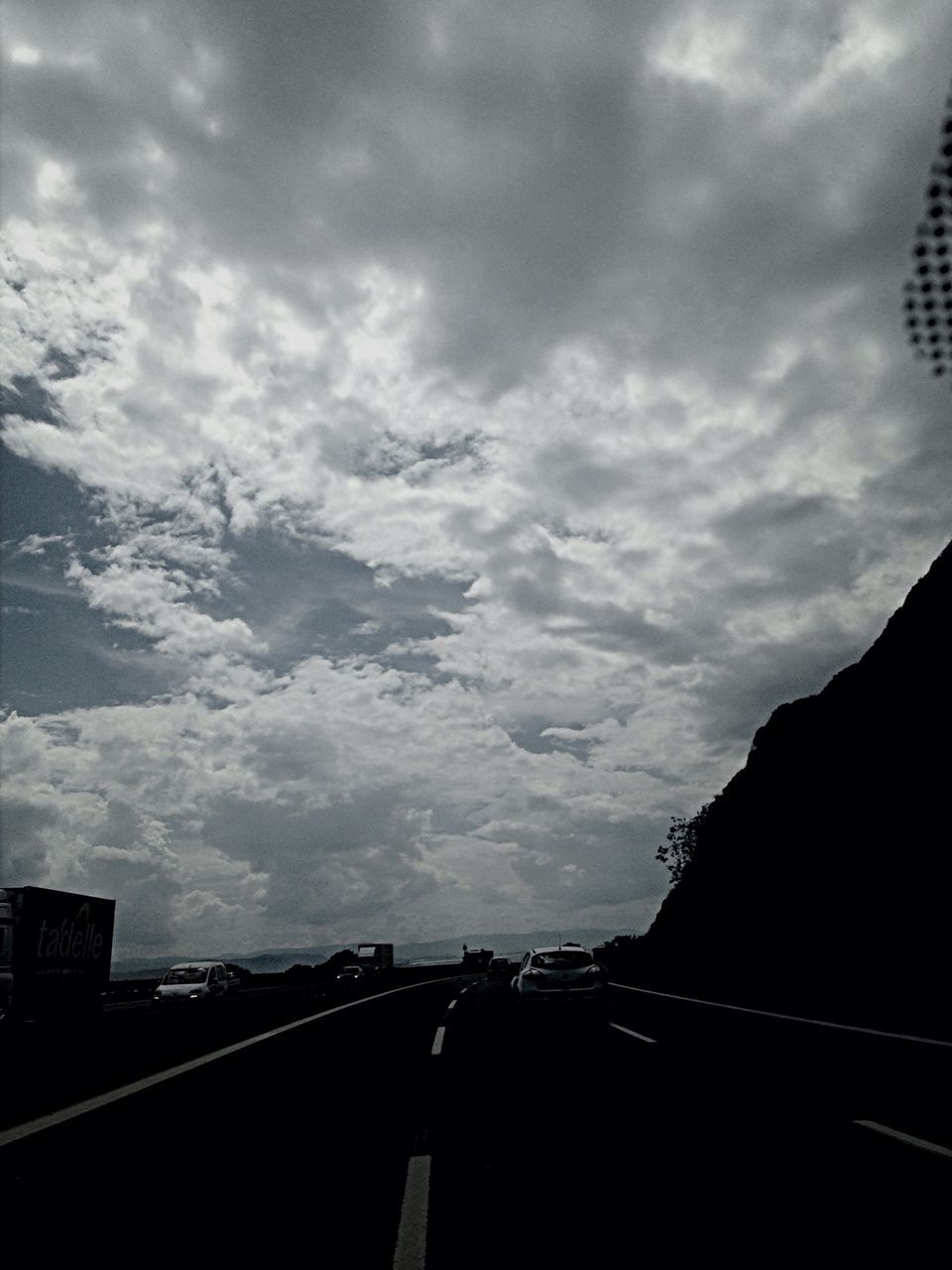 sky, cloud - sky, architecture, built structure, cloudy, building exterior, mountain, cloud, transportation, outdoors, nature, silhouette, city, road, weather, dusk, no people, scenics, beauty in nature, tranquility