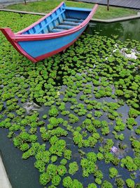High angle view of boat floating on lake
