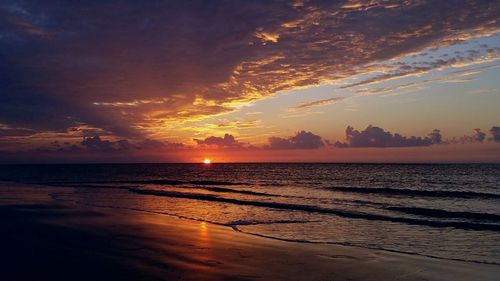 Scenic view of sea against sky at sunset