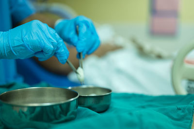 Close-up of hand holding blue tea