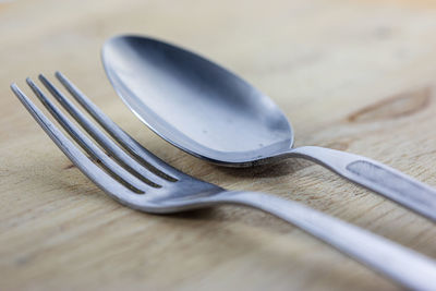 Close-up of fork and spoon on table