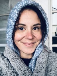 Portrait of smiling woman in snow