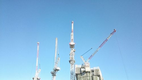 Low angle view of tower against blue sky