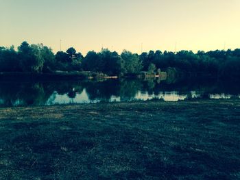 Scenic view of lake and trees against sky