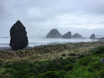 Scenic view of sea against cloudy sky